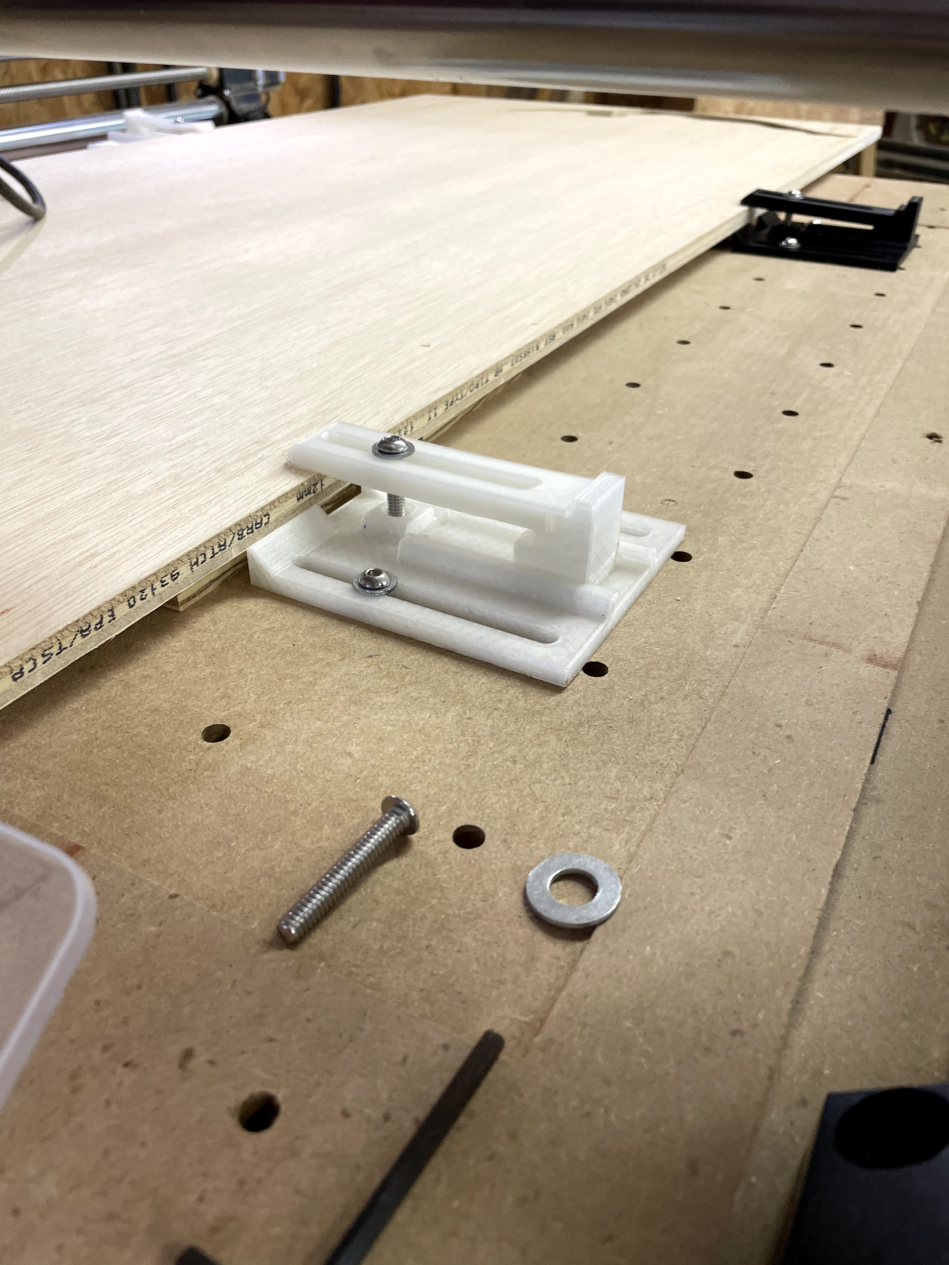 Adjustable CNC hold down clamp on Onefinity wastebord