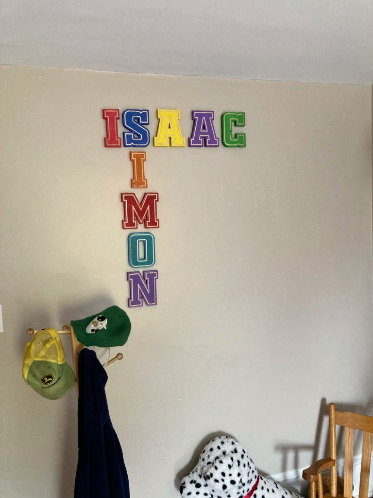 Image showing personalized multi-color varsity block letters made of plywood using a Onefinity CNC router, ideal for a child's room decoration